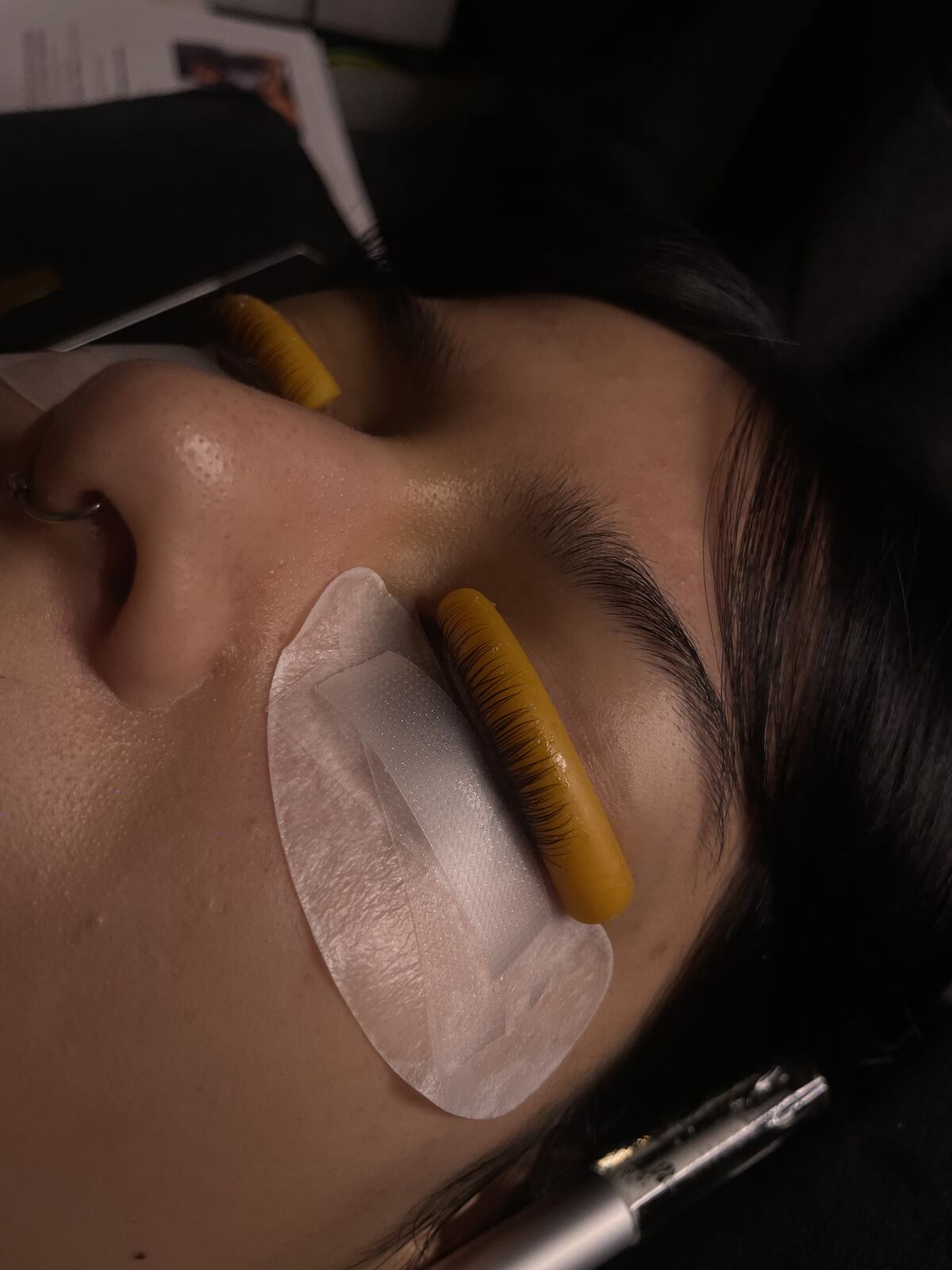 Lash lift in progress with silicone shield
