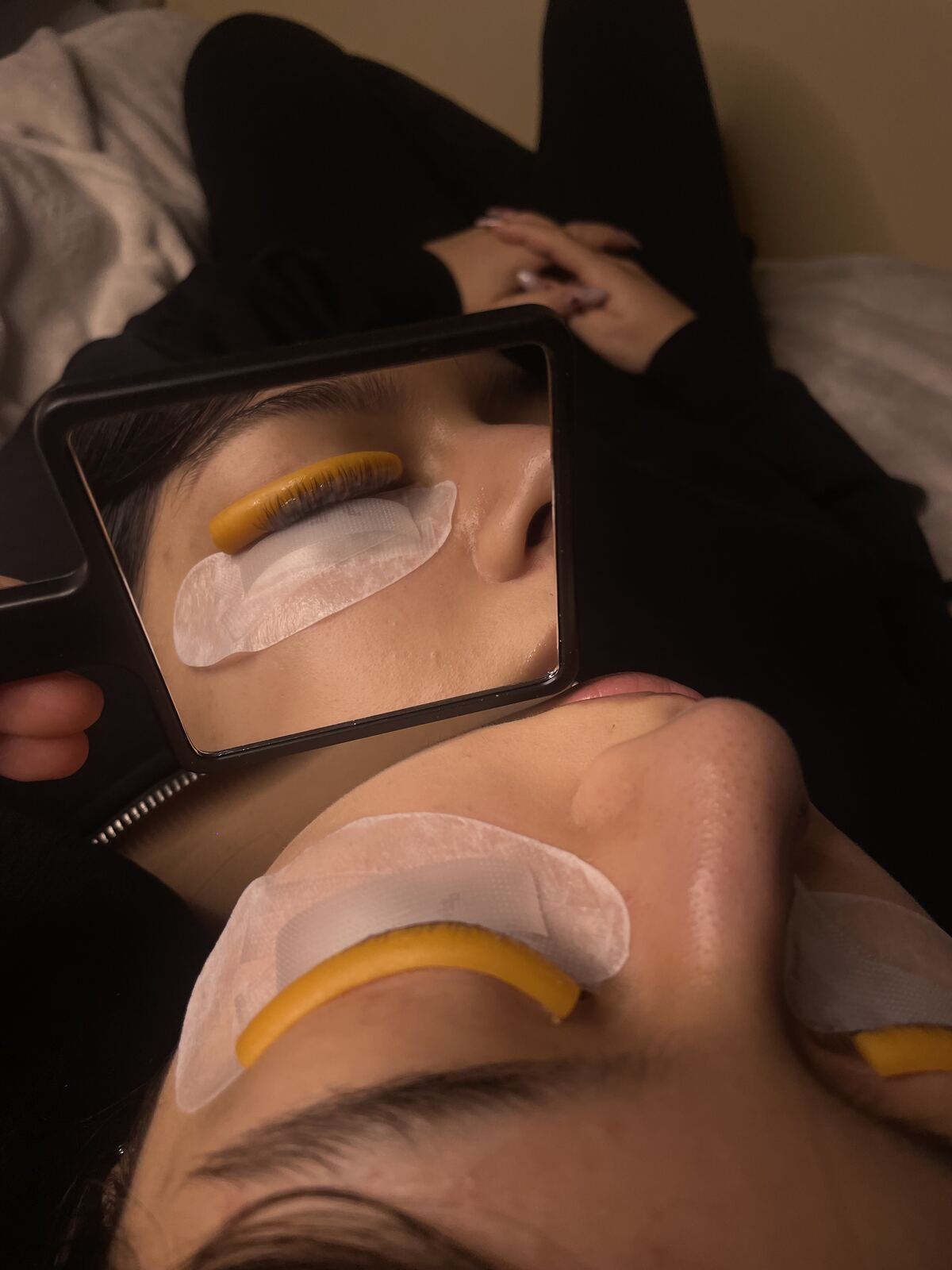 Lash lift treatment in progress, shield in place